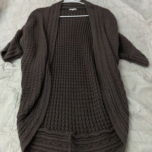 Maurice's grey sweater